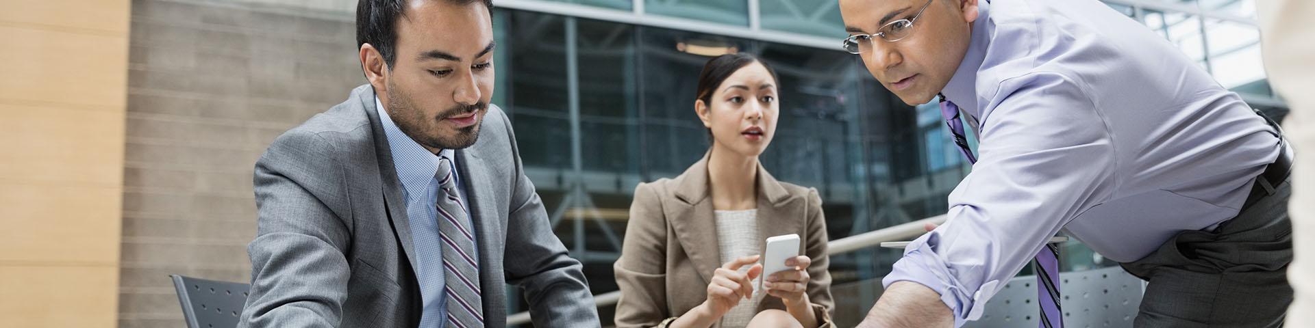 Three people in business meeting